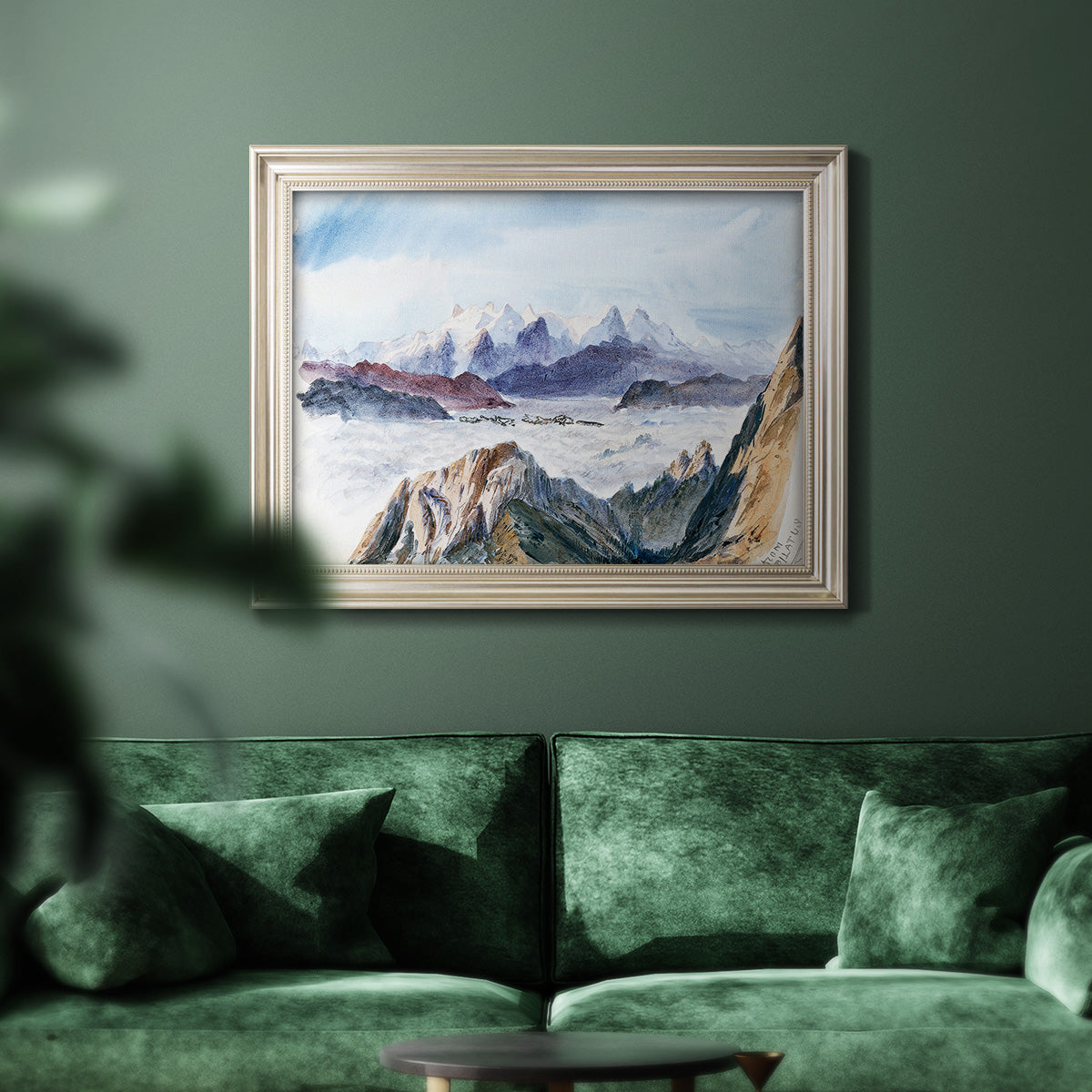 Impressionist alpine mountain landscape by John Singer Sargent in an ornate champagne frame displayed in a dark-toned interior setting.