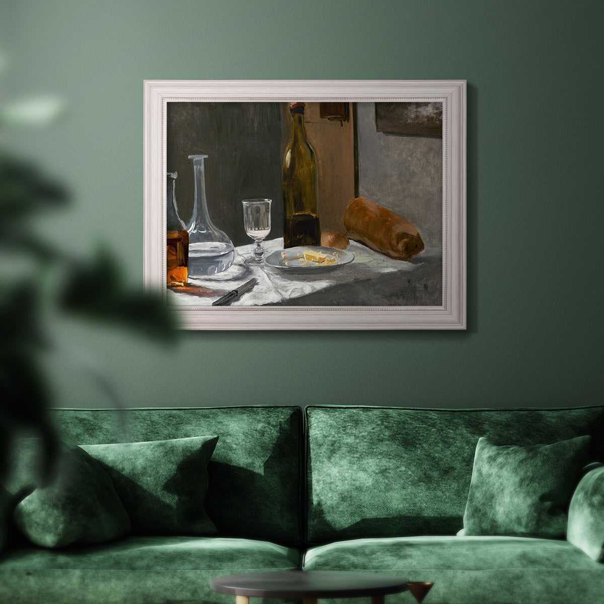Impressionist still life with wine and bread by Claude Monet in an ornate weathered white frame displayed in a dark-toned interior setting.