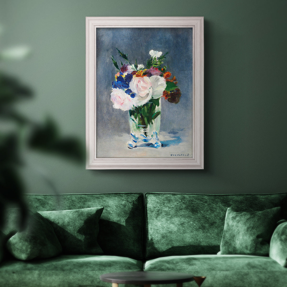 Impressionist floral still life painting by Claude Monet in an ornate weathered white frame displayed in a dark-toned interior setting.