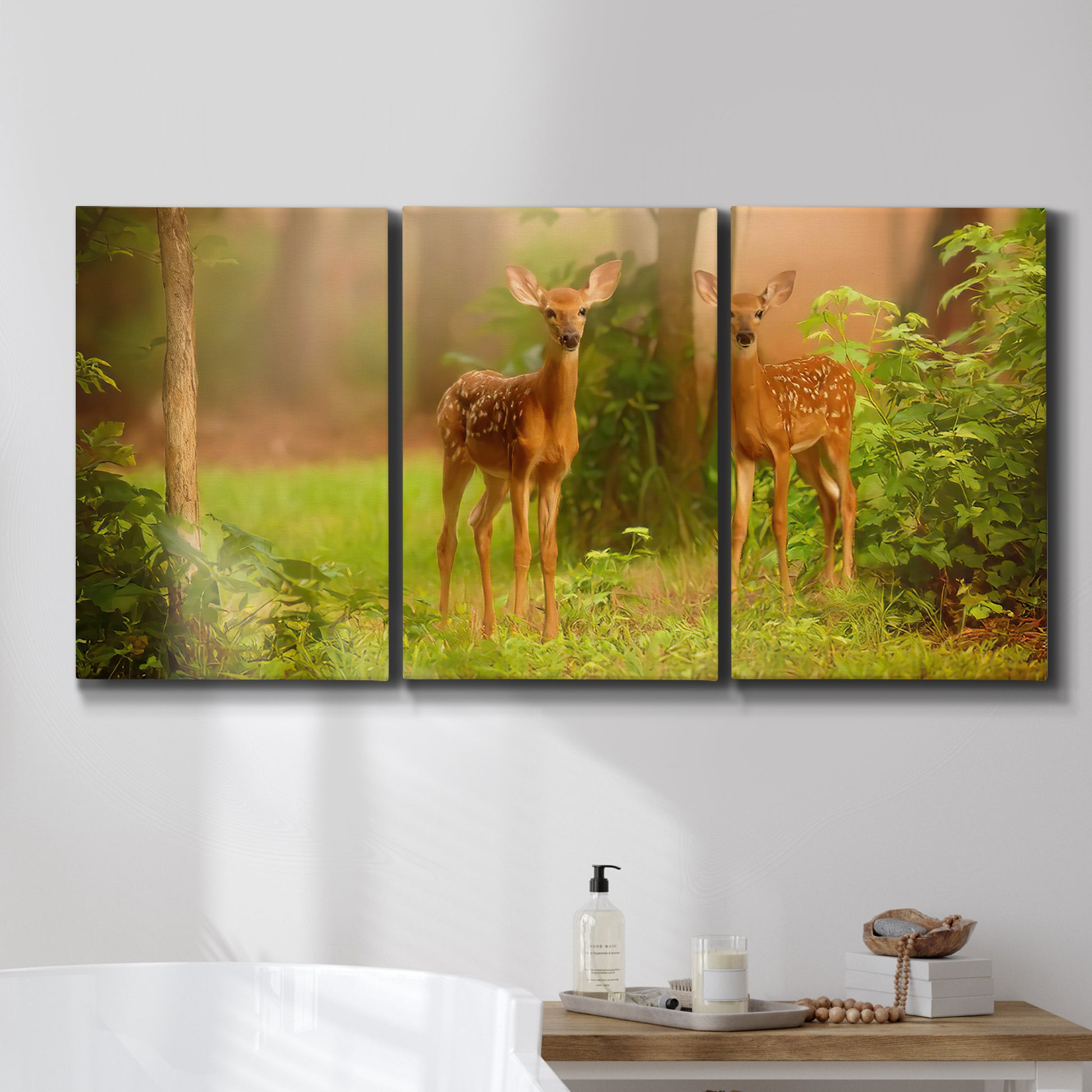 Three-panel canvas wall art featuring resting animals in open field, displayed in a bathroom above a bathtub.