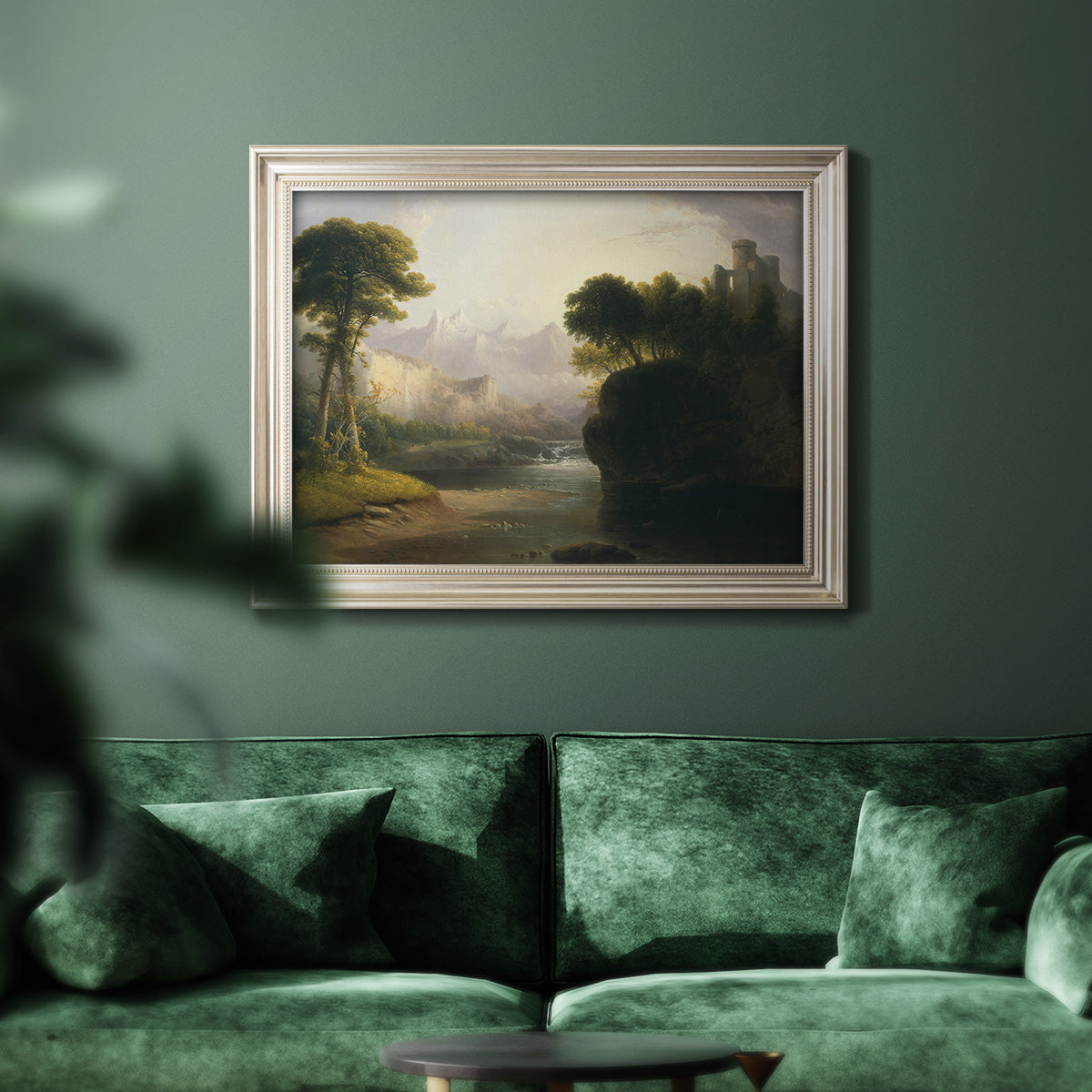 Romantic autumn landscape along the Hudson River by Thomas Doughty in an ornate champagne frame displayed in a dark-toned interior setting.