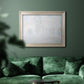Impressionist atmospheric landscape in morning haze by Claude Monet in an ornate champagne frame displayed in a dark-toned interior setting.