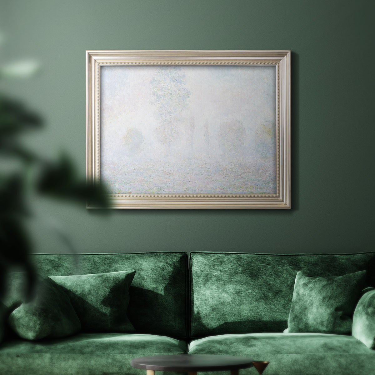 Impressionist atmospheric landscape in morning haze by Claude Monet in an ornate champagne frame displayed in a dark-toned interior setting.