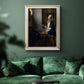 Quiet interior genre scene of a woman with scales by Johannes Vermeer in an ornate champagne frame displayed in a dark-toned interior setting.