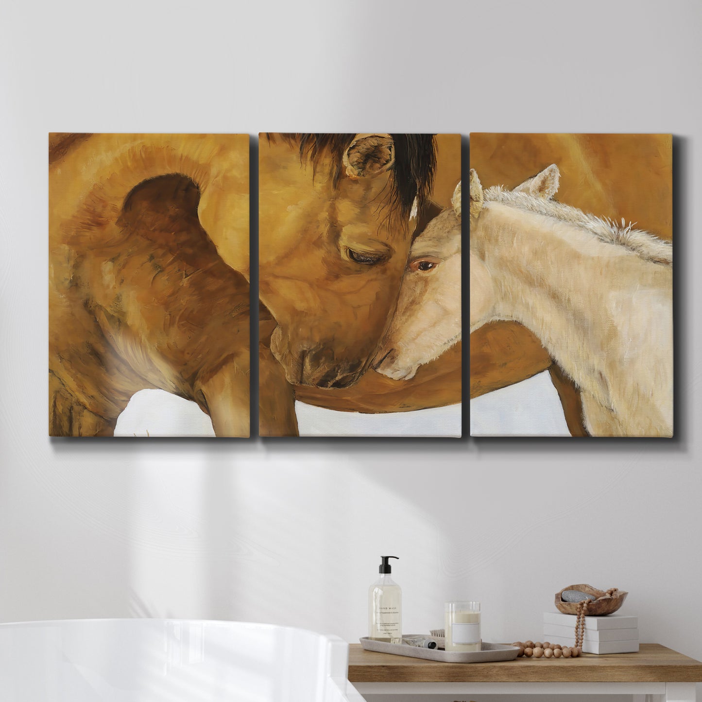 Three-panel canvas wall art featuring gentle horse portrait illustration, displayed in a bathroom above a bathtub.