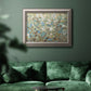 Impressionist flowering vine watercolor artwork in an ornate vintage silver frame displayed in a dark-toned interior setting.