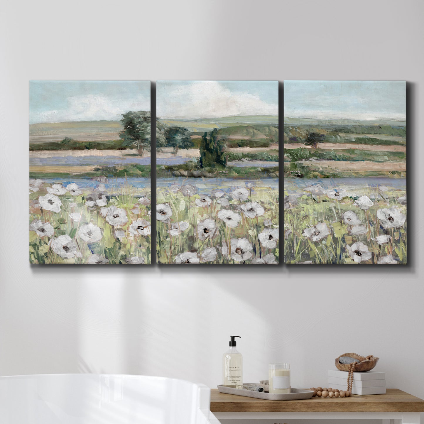 Three-panel canvas wall art featuring vintage poppy filled valley, displayed in a bathroom above a bathtub.