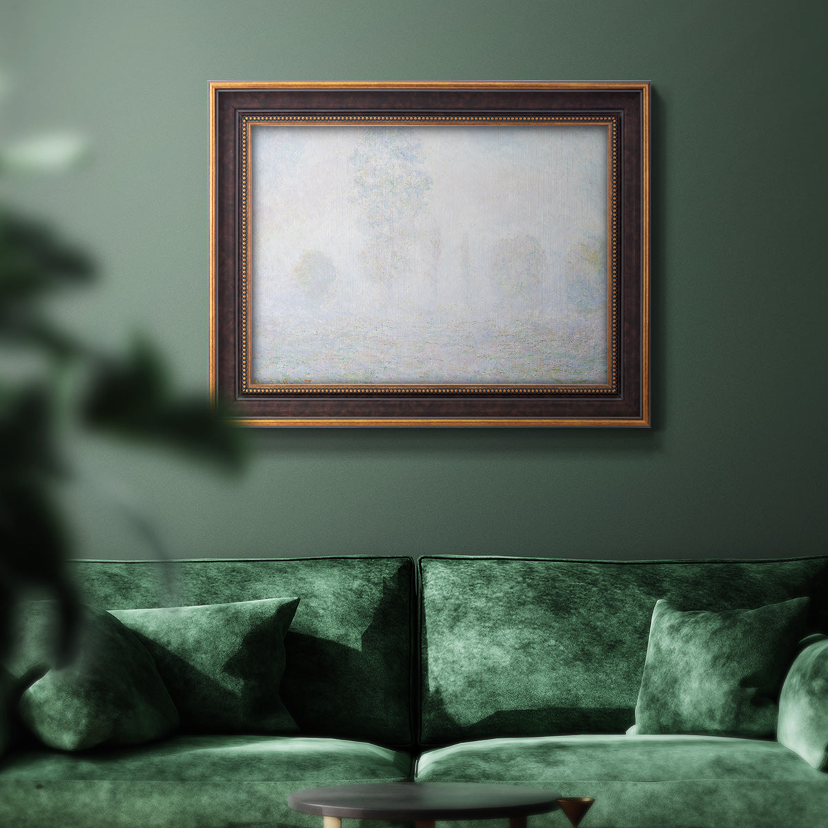 Impressionist atmospheric landscape in morning haze by Claude Monet in an ornate bronzed mahogany wood frame displayed in a dark-toned interior setting.