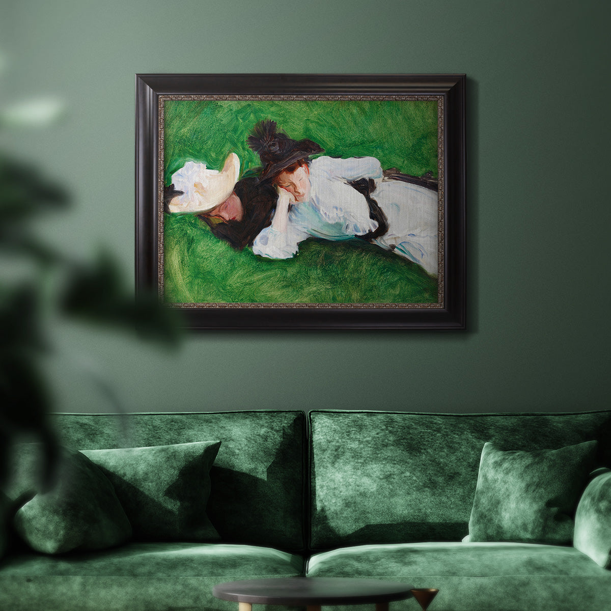 Impressionist outdoor portrait of two girls by John Singer Sargent in an ornate black frame with gilded inner detail displayed in a dark-toned interior setting.
