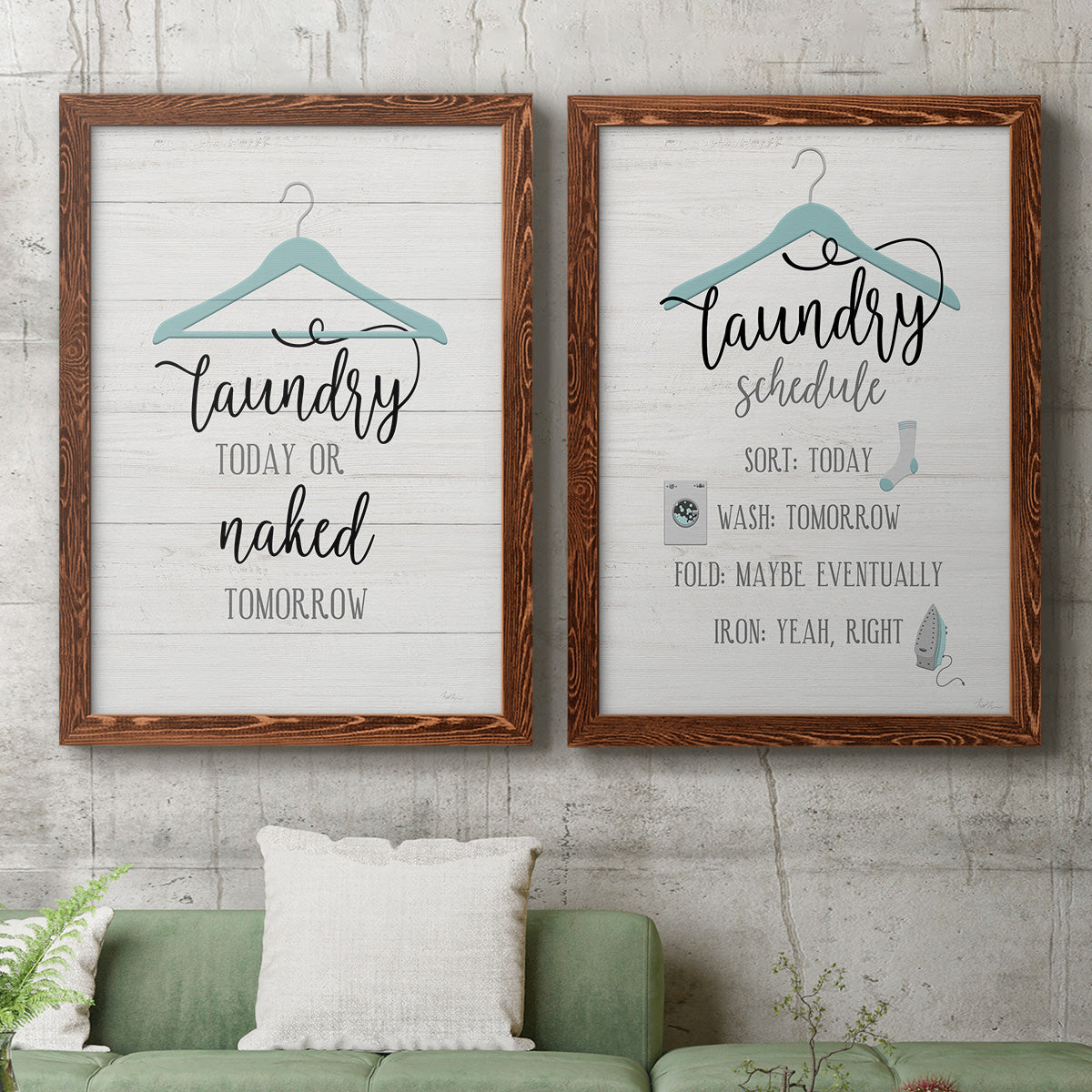 Set of two maple barnwood framed canvas prints depicting a coordinated art pair of humorous laundry-room sayings and clothing icons rendered as rustic typographic wall art above a sofa in a modern living room.