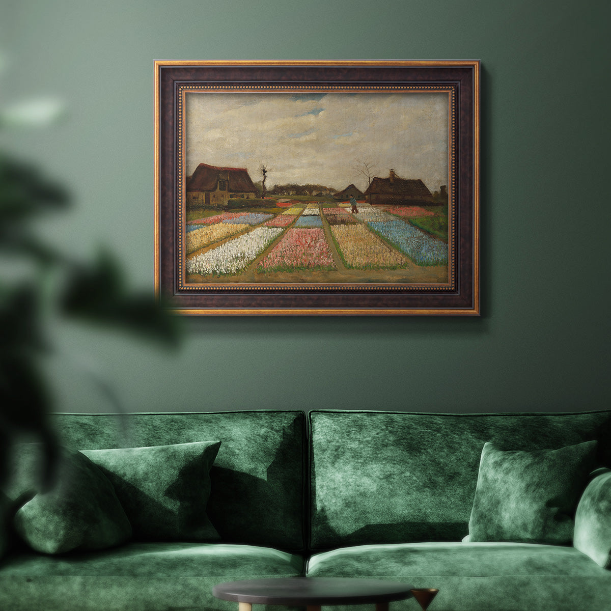 Impressionist Dutch bulb field landscape by Vincent van Gogh in an ornate bronzed mahogany wood frame displayed in a dark-toned interior setting.