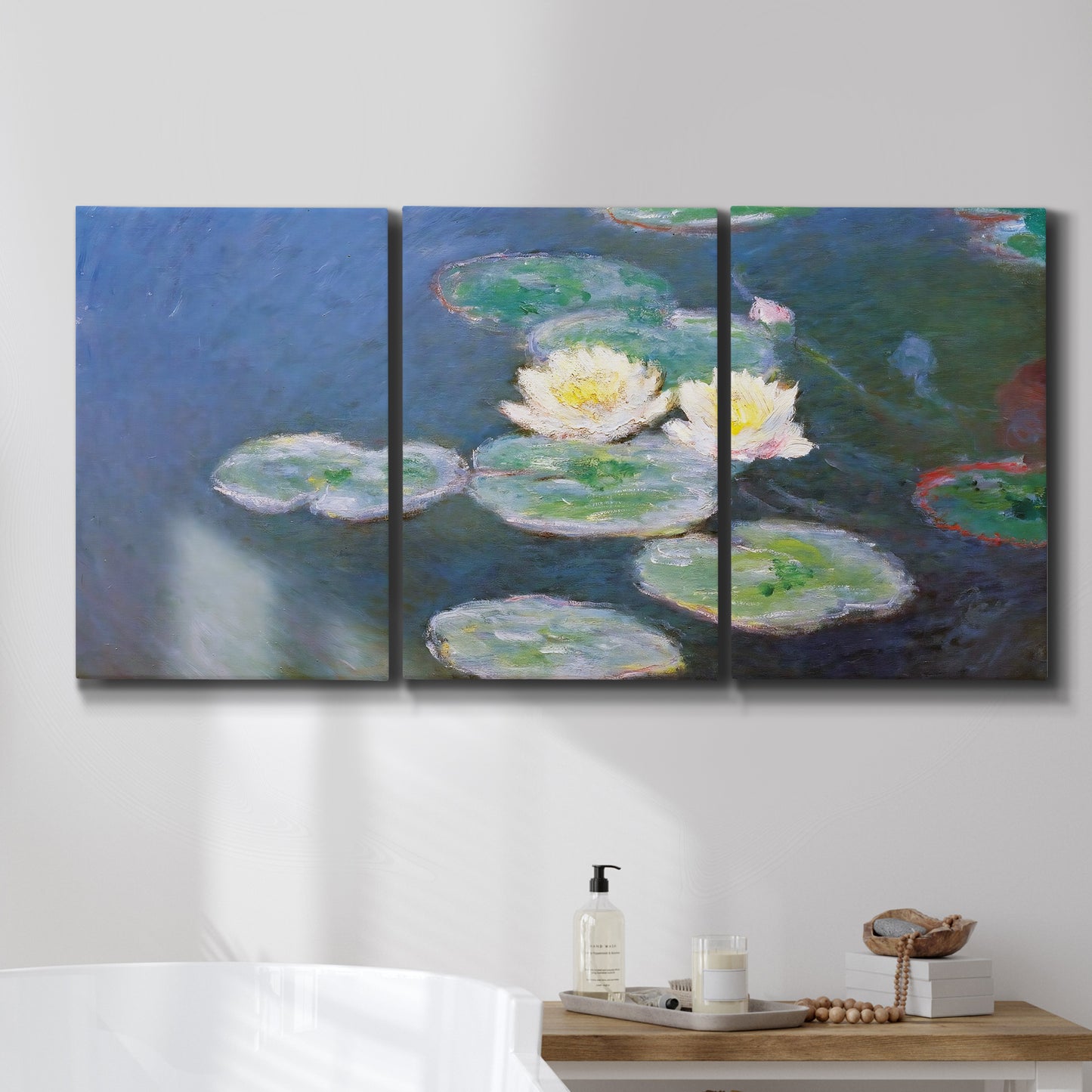 Three-panel canvas wall art featuring water lilies floating on pond, displayed in a bathroom above a bathtub.
