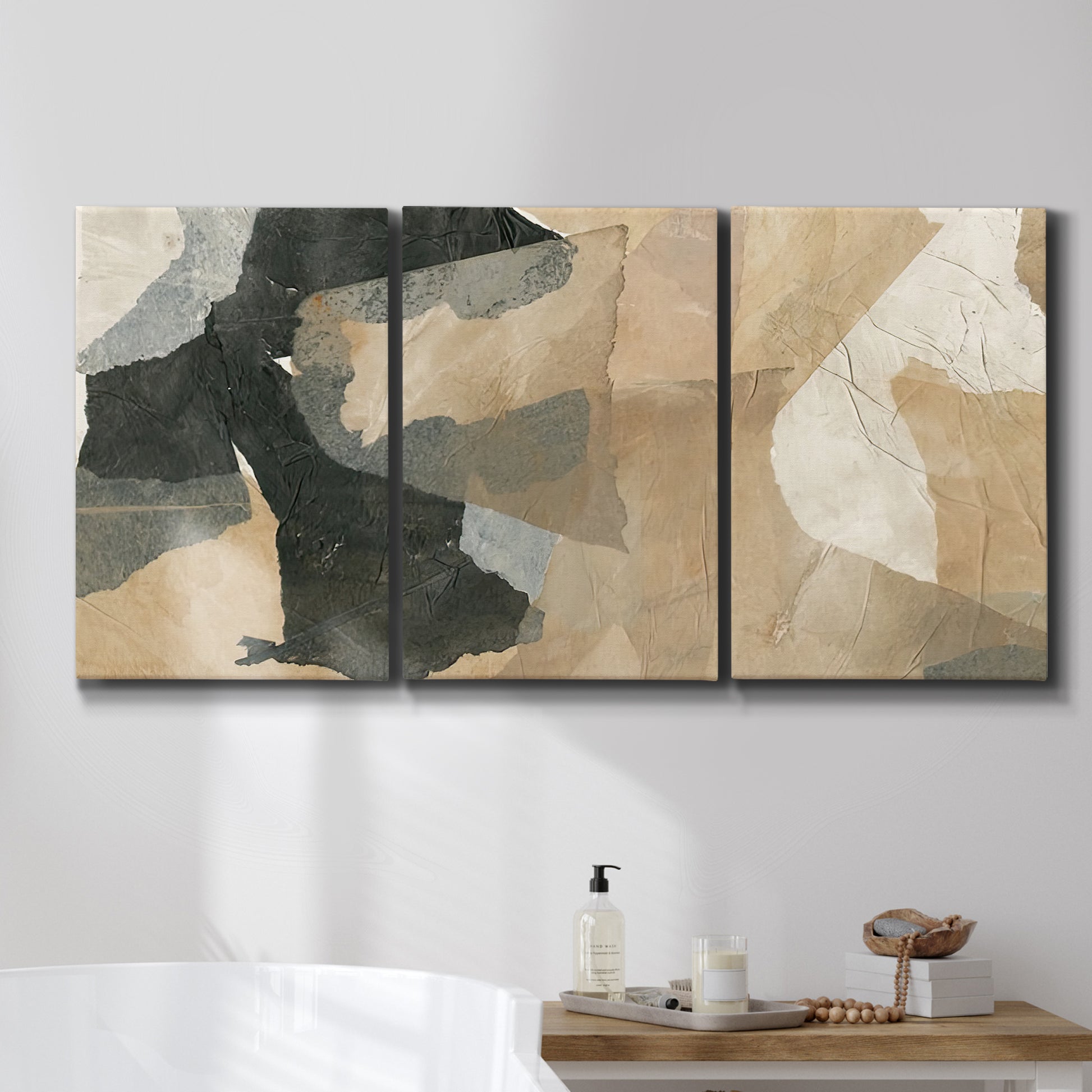 Three-panel canvas wall art featuring blurred mixed media abstract collage, displayed in a bathroom above a bathtub.