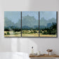 Three-panel canvas wall art featuring rural farmland landscape in watercolor, displayed in a bathroom above a bathtub.