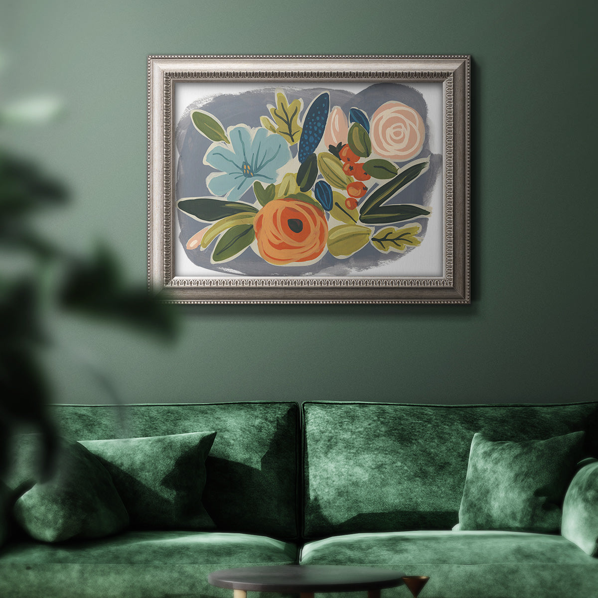 Bold modern botanical illustration in an ornate vintage silver frame displayed in a dark-toned interior setting.