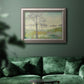 Traditional watercolor tree landscape artwork in an ornate vintage silver frame displayed in a dark-toned interior setting.