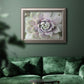 Soft abstract floral botanical photography in an ornate vintage silver frame displayed in a dark-toned interior setting.