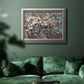 Modern spring dogwood flower photograph in an ornate vintage silver frame displayed in a dark-toned interior setting.