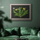 Vintage botanical dandelion flower illustration in an ornate vintage silver frame displayed in a dark-toned interior setting.