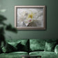 Neutral white peony photography in an ornate vintage silver frame displayed in a dark-toned interior setting.
