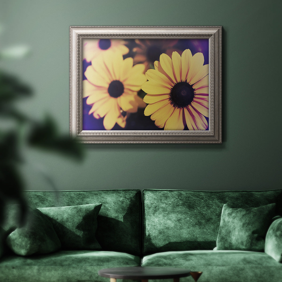 Contemporary yellow Susan floral photograph in an ornate vintage silver frame displayed in a dark-toned interior setting.