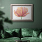 Minimalist pink flower abstract artwork in an ornate vintage silver frame displayed in a dark-toned interior setting.