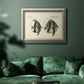 Antique fish species illustration diagram in an ornate vintage silver frame displayed in a dark-toned interior setting.