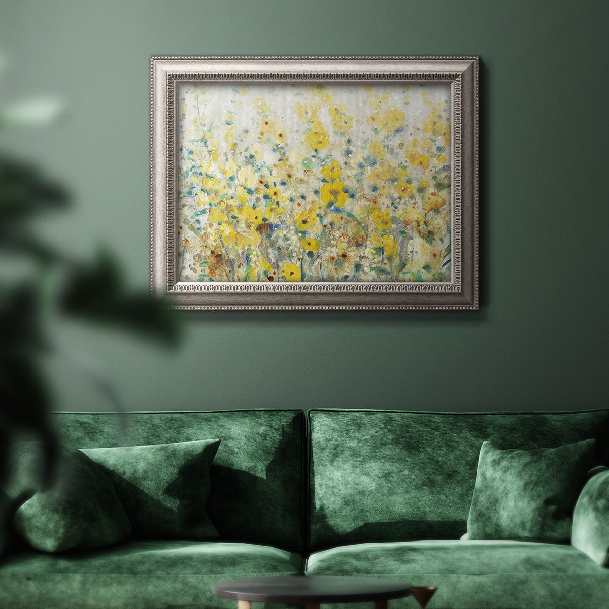 French country floral garden artwork in an ornate vintage silver frame displayed in a dark-toned interior setting.