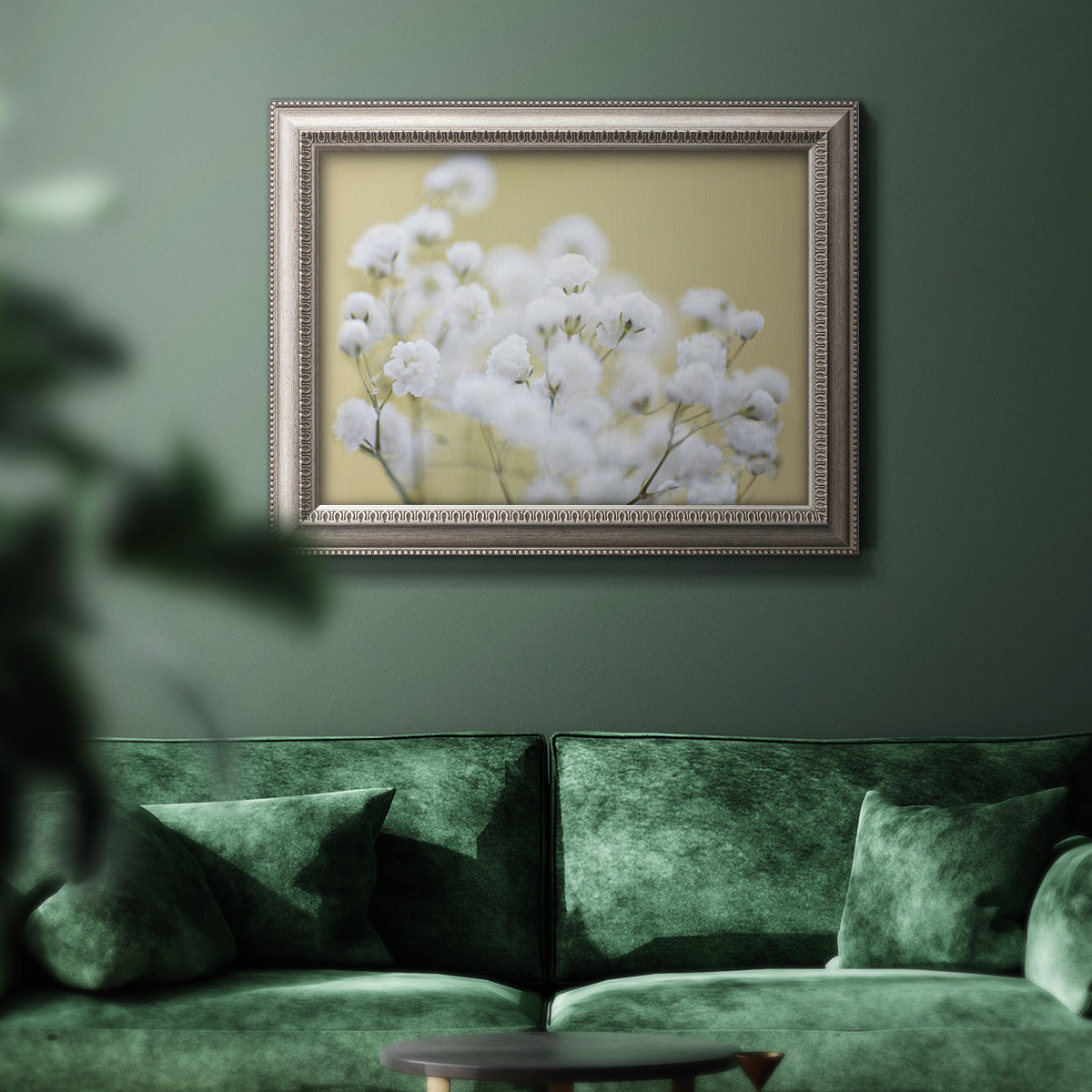 Minimal floral baby’s breath photography in an ornate vintage silver frame displayed in a dark-toned interior setting.