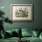 Antique Louisiana heron bird illustration by John James Audubon in an ornate vintage silver frame displayed in a dark-toned interior setting.