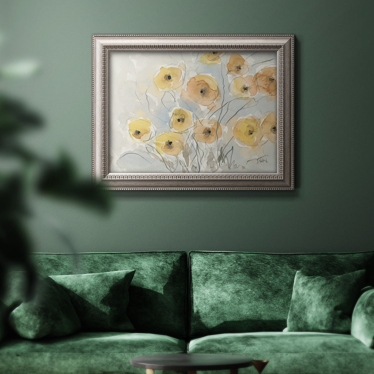 Minimalist poppy flower watercolor artwork in an ornate vintage silver frame displayed in a dark-toned interior setting.