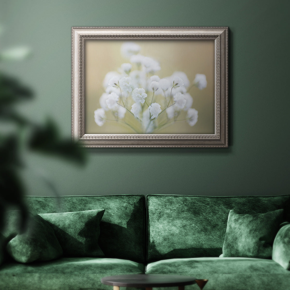 Botanical baby’s breath flower photography in an ornate vintage silver frame displayed in a dark-toned interior setting.