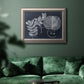 Vintage botanical foliage illustration on navy background in an ornate vintage silver frame displayed in a dark-toned interior setting.