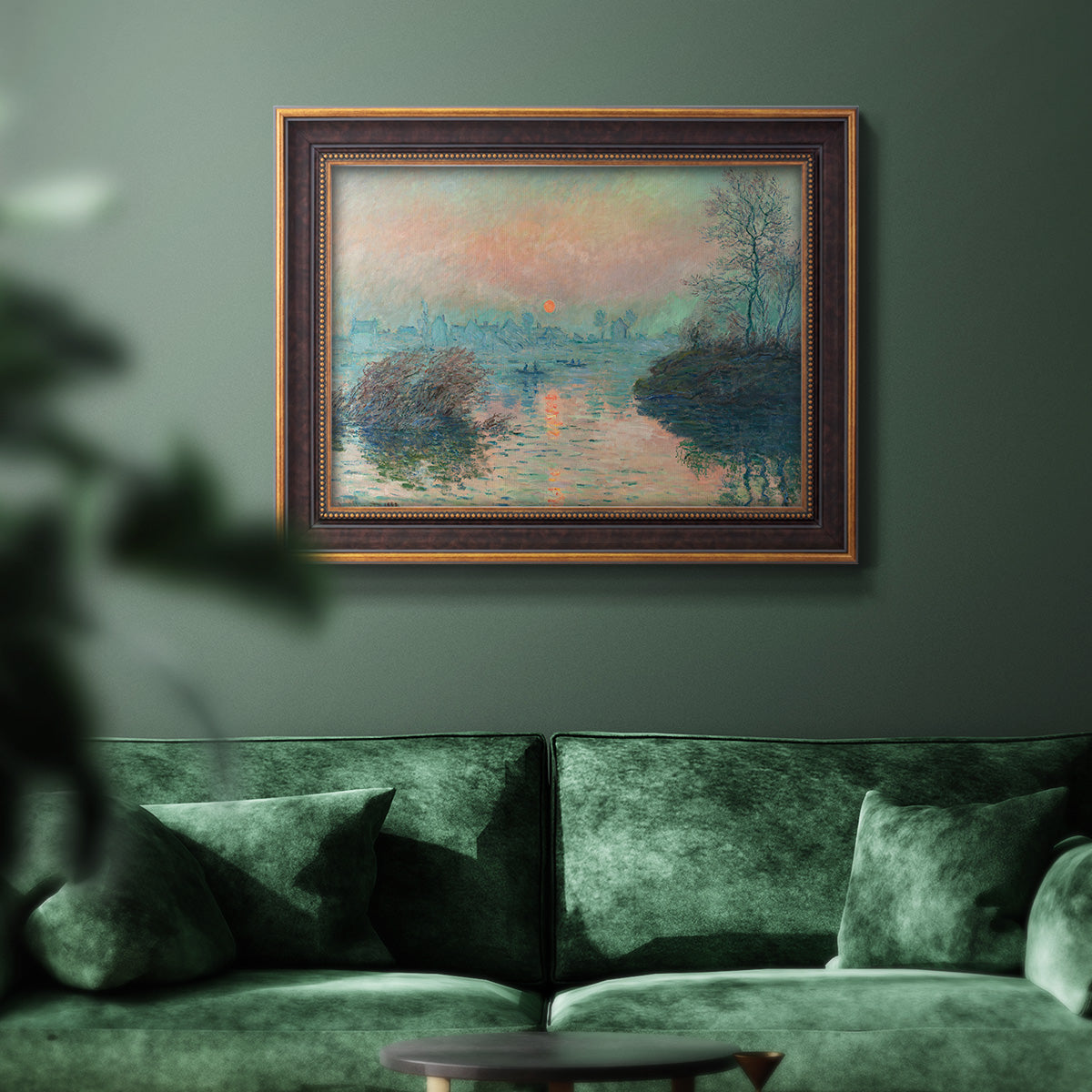Impressionist winter river sunset scene by Claude Monet in an ornate bronzed mahogany wood frame displayed in a dark-toned interior setting.