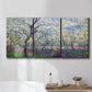 Three-panel canvas wall art featuring fresh spring countryside landscape, displayed in a bathroom above a bathtub.