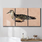 Three-panel canvas wall art featuring coastal bird illustration, displayed in a bathroom above a bathtub.