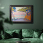 Pointillist coastal seascape by Paul Signac in an ornate black frame with gilded inner detail displayed in a dark-toned interior setting.