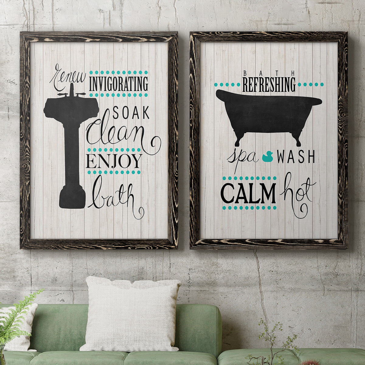 Set of two black barnwood framed canvas prints depicting a coordinated art pair of playful bathtub silhouettes and bath-themed typography rendered as graphic bathroom word art above a sofa in a modern living room.