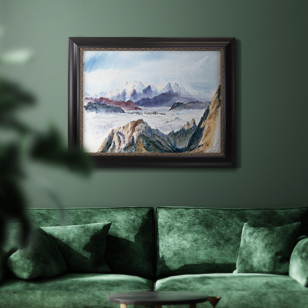 Impressionist alpine mountain landscape by John Singer Sargent in an ornate black frame with gilded inner detail displayed in a dark-toned interior setting.