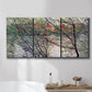 Three-panel canvas wall art featuring riverside park with figures and trees, displayed in a bathroom above a bathtub.