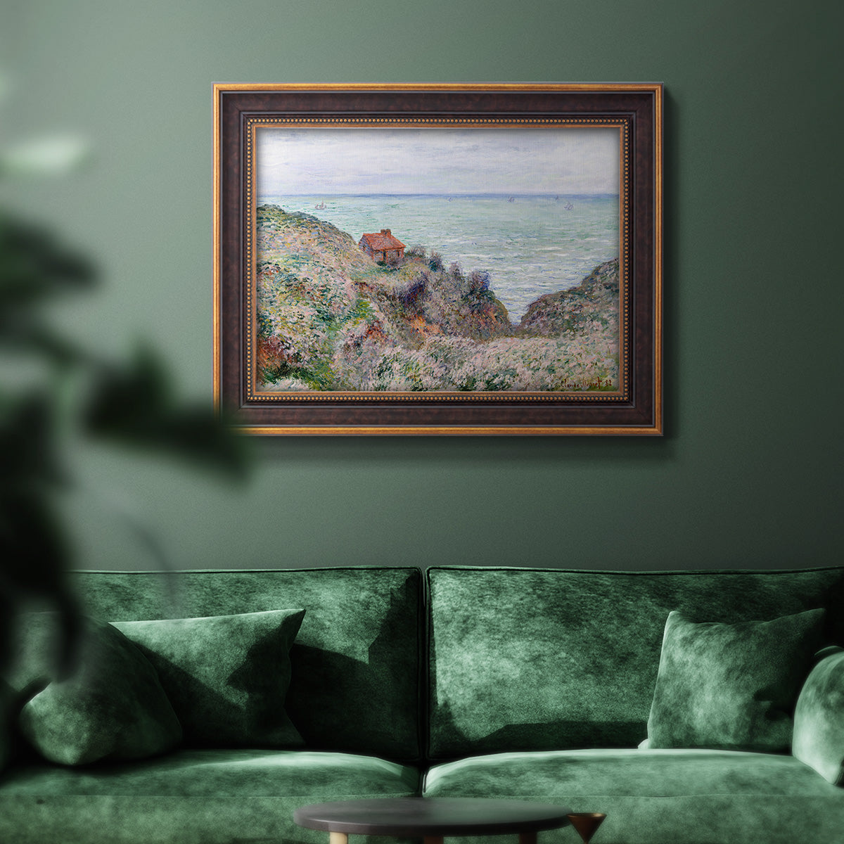 Impressionist coastal watch cabin scene by Claude Monet in an ornate bronzed mahogany wood frame displayed in a dark-toned interior setting.