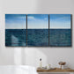 Three-panel canvas wall art featuring open water landscape with wide horizon, displayed in a bathroom above a bathtub.