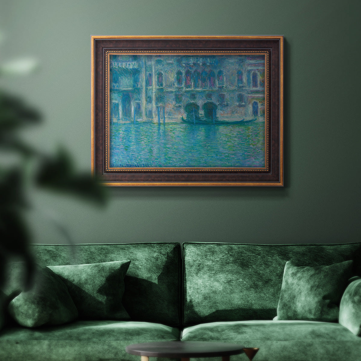 Impressionist Venetian palace waterfront scene by Claude Monet in an ornate bronzed mahogany wood frame displayed in a dark-toned interior setting.