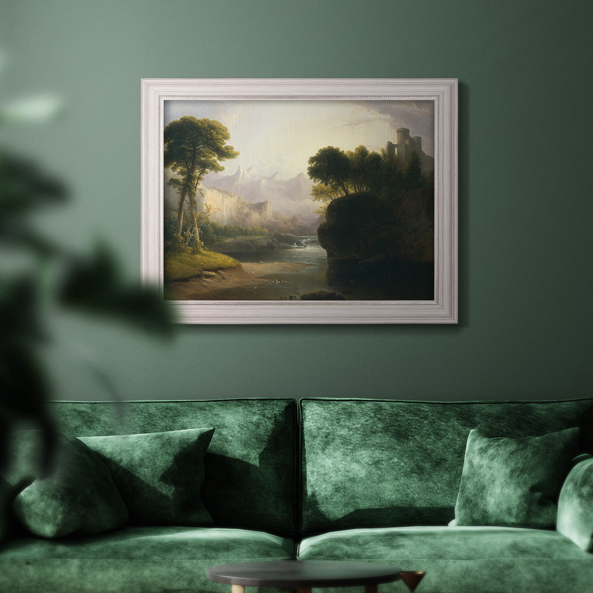 Romantic autumn landscape along the Hudson River by Thomas Doughty in an ornate weathered white frame displayed in a dark-toned interior setting.