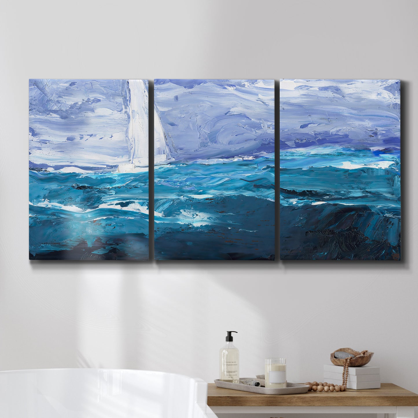 Three-panel canvas wall art featuring impressionist nautical harbor scene, displayed in a bathroom above a bathtub.
