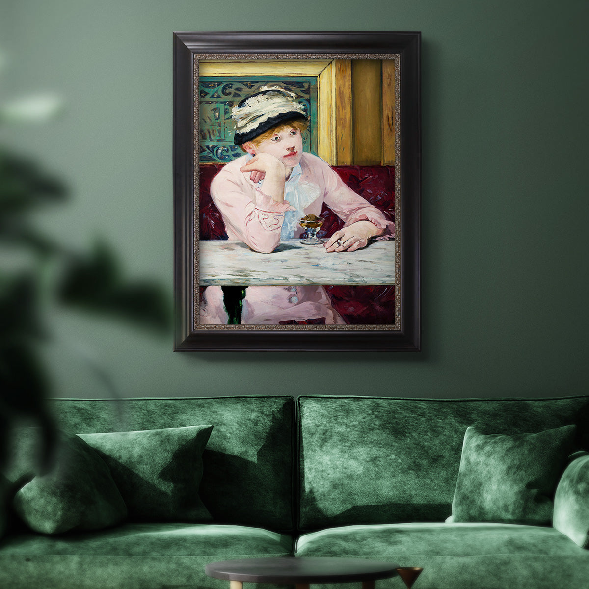 Impressionist portrait scene with plum brandy by Édouard Manet in an ornate black frame with gilded inner detail displayed in a dark-toned interior setting.