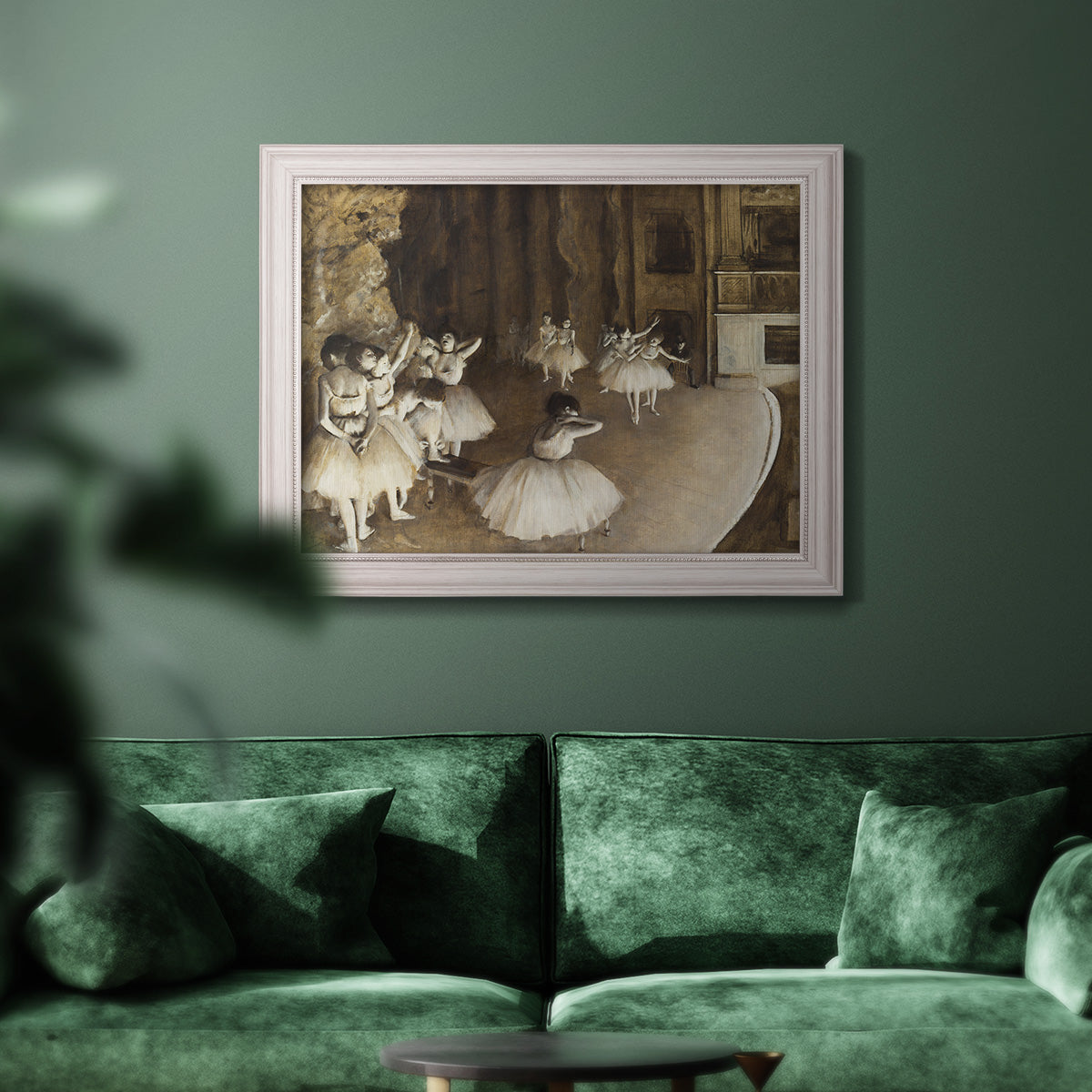 Impressionist ballet rehearsal scene by Edgar Degas in an ornate weathered white frame displayed in a dark-toned interior setting.
