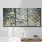 Three-panel canvas wall art featuring abstract water surface reflections, displayed in a bathroom above a bathtub.