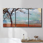 Three-panel canvas wall art featuring coastal trees at evening light, displayed in a bathroom above a bathtub.