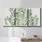 Three-panel canvas wall art featuring foraged leafy greens botanical study, displayed in a bathroom above a bathtub.